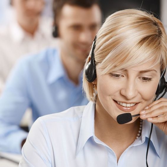 6374258 - portrait of young customer service operator talking on headset, smiling.